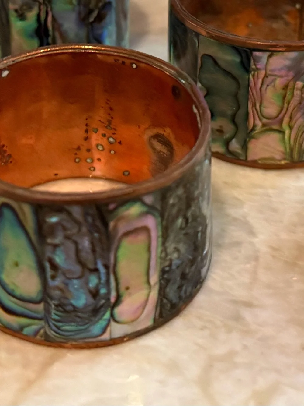 Copper and abalone shell napkin rings